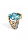 Styliano anillo de plata y oro con topacio azul